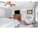 Comfortable main bedroom with chair and TV and an ensuite bathroom at 9803 Forest Run Ln, Charlotte, NC 28277