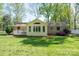 Brick home with a sunroom and lush green backyard at 1 Horace Grigg Cir, Shelby, NC 28152