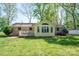 Brick home with a sunroom and lush green backyard at 1 Horace Grigg Cir, Shelby, NC 28152