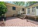 Exterior shot of the home's backyard, highlighting the brick patio and deck, great for outdoor relaxation at 1 Horace Grigg Cir, Shelby, NC 28152