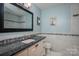 Bathroom featuring a granite counter, modern fixtures, and attractive tile work for a luxurious feel at 1 Horace Grigg Cir, Shelby, NC 28152
