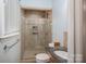 Bathroom featuring a tiled shower stall with glass door and granite countertop at 1 Horace Grigg Cir, Shelby, NC 28152