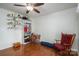 Bedroom with hardwood floors, ceiling fan, and built-in shelving for storage at 1 Horace Grigg Cir, Shelby, NC 28152