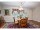 Cozy dining room featuring wooden furniture, an area rug, a window, and a decorative light fixture at 1 Horace Grigg Cir, Shelby, NC 28152