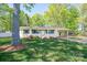 Charming brick ranch home with a well-manicured lawn, cozy front porch, and convenient carport at 1 Horace Grigg Cir, Shelby, NC 28152