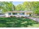 Charming brick ranch home with a well-manicured lawn, cozy front porch, and convenient carport at 1 Horace Grigg Cir, Shelby, NC 28152