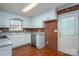 Well-lit kitchen with white cabinets, granite countertops, and stainless steel dishwasher at 1 Horace Grigg Cir, Shelby, NC 28152