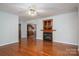 Inviting living room with hardwood floors, fireplace, and built-in display cabinet adjacent to the dining room at 1 Horace Grigg Cir, Shelby, NC 28152
