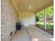 Covered patio with brick accents and access to the backyard provides ample space for outdoor enjoyment at 1 Horace Grigg Cir, Shelby, NC 28152