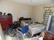 Shows the main bedroom, with full sized bed, wheelchair, and other items at 107 N Rudisill Ave, Cherryville, NC 28021