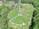 A complete aerial view of the neighborhood park which has playground, green fields, and a gazebo at 111 Woodfern Pl, Mooresville, NC 28115