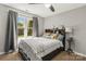 Cozy bedroom with a large window, and comfortable bed with stylish pillows at 111 Woodfern Pl, Mooresville, NC 28115