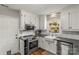 Charming kitchen with white cabinets, subway tile, and stainless-steel appliances at 111 Woodfern Pl, Mooresville, NC 28115