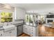 Well-lit kitchen opens to living room, featuring stainless steel appliances and lots of counter space at 111 Woodfern Pl, Mooresville, NC 28115