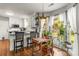 Open-concept kitchen with eat-in breakfast bar and charming breakfast nook overlooking backyard at 111 Woodfern Pl, Mooresville, NC 28115