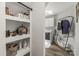 Charming laundry room featuring vintage decor, modern washer and dryer, and stylish wood floors at 111 Woodfern Pl, Mooresville, NC 28115