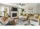 Spacious living room features a fireplace, a large sectional sofa, and lots of natural light at 111 Woodfern Pl, Mooresville, NC 28115