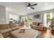 Open-concept living space featuring a kitchen view, breakfast nook, and a spacious seating area at 111 Woodfern Pl, Mooresville, NC 28115