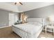 Comfortable main bedroom featuring neutral colors, a tufted headboard, and lots of natural light at 111 Woodfern Pl, Mooresville, NC 28115