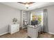 Home office with desk, comfortable chair, and ample natural light streaming through the window at 111 Woodfern Pl, Mooresville, NC 28115