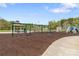 A safe and fun playground features swings, climbing structures, and a soft surface underfoot at 111 Woodfern Pl, Mooresville, NC 28115