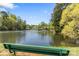 Picturesque pond view from a park bench, showcasing serene water and lush greenery at 111 Woodfern Pl, Mooresville, NC 28115