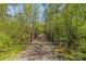 Scenic walking bridge surrounded by lush trees, offering a peaceful outdoor experience at 111 Woodfern Pl, Mooresville, NC 28115