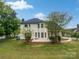 Manicured backyard with patio and well-maintained lawn at 1121 Setter Se Ln, Concord, NC 28025