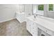 Bright bathroom featuring double vanity sinks, spacious counter, and natural light at 1121 Setter Se Ln, Concord, NC 28025