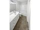 Well-lit bathroom with a vanity, toilet, and tub-shower combo at 1121 Setter Se Ln, Concord, NC 28025