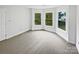 Sun-filled bedroom with multiple windows offering lovely outdoor views at 1121 Setter Se Ln, Concord, NC 28025