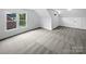 Bonus room featuring neutral carpeting and natural light from windows at 1121 Setter Se Ln, Concord, NC 28025