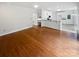 Open floor plan with gorgeous hardwood flooring, white walls, and white trim at 1121 Setter Se Ln, Concord, NC 28025