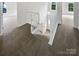 Bright staircase with carpeted stairs and white wooden railing at 1121 Setter Se Ln, Concord, NC 28025