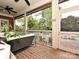The back porch is screened in and overlooks the luxurious pool at 1126 Concord Rd, Davidson, NC 28036