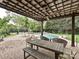 This outdoor dining area overlooks the pool and lounge chairs in the back yard at 1126 Concord Rd, Davidson, NC 28036