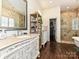 Bathroom with ornate cabinets, walk-in shower, and tile flooring at 1126 Concord Rd, Davidson, NC 28036