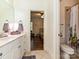 Hall bathroom with combination tub and shower featuring tile surround and neutral colored vanity at 1126 Concord Rd, Davidson, NC 28036