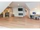 Spacious bonus room featuring a sauna, fireplace, built-in desk, and ample lighting at 1126 Concord Rd, Davidson, NC 28036