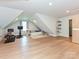 Versatile bonus room with hardwood floors, daybed, reading nook and workout equipment, bathed in natural light at 1126 Concord Rd, Davidson, NC 28036