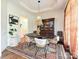 Formal dining room with decorative lighting, unique chairs, and an antique hutch for elegant dining at 1126 Concord Rd, Davidson, NC 28036