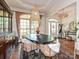 Elegant dining room with a modern light fixture, stylish decor, and plenty of natural light at 1126 Concord Rd, Davidson, NC 28036