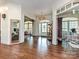 Elegant entry featuring hardwood floors, sophisticated decor, and views into adjacent living spaces at 1126 Concord Rd, Davidson, NC 28036