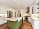 Kitchen with stainless appliances, white cabinets, farmhouse sink, and center island at 1126 Concord Rd, Davidson, NC 28036