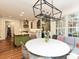 Bright eat-in kitchen featuring stainless appliances, white cabinets, and view of a large dining area at 1126 Concord Rd, Davidson, NC 28036