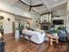 Open-concept living room with coffered ceilings, fireplace, and hardwood floors at 1126 Concord Rd, Davidson, NC 28036