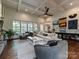 Bright living room with large windows, stylish furniture, and a decorative rug at 1126 Concord Rd, Davidson, NC 28036