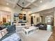 Bright living room with coffered ceilings, ceiling fan, modern decor, and views into the entryway at 1126 Concord Rd, Davidson, NC 28036