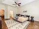 Main bedroom featuring hardwood floors, ceiling fan, and ensuite bathroom at 1126 Concord Rd, Davidson, NC 28036