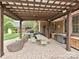 The outdoor dining area has seating for eight and is covered by a pergola at 1126 Concord Rd, Davidson, NC 28036